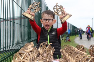 kid with trophies